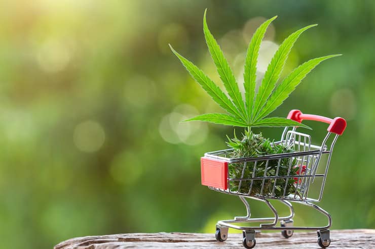 Cannabis leaves and products in a shopping cart representing dispensary product selection in Pahrump Nevada