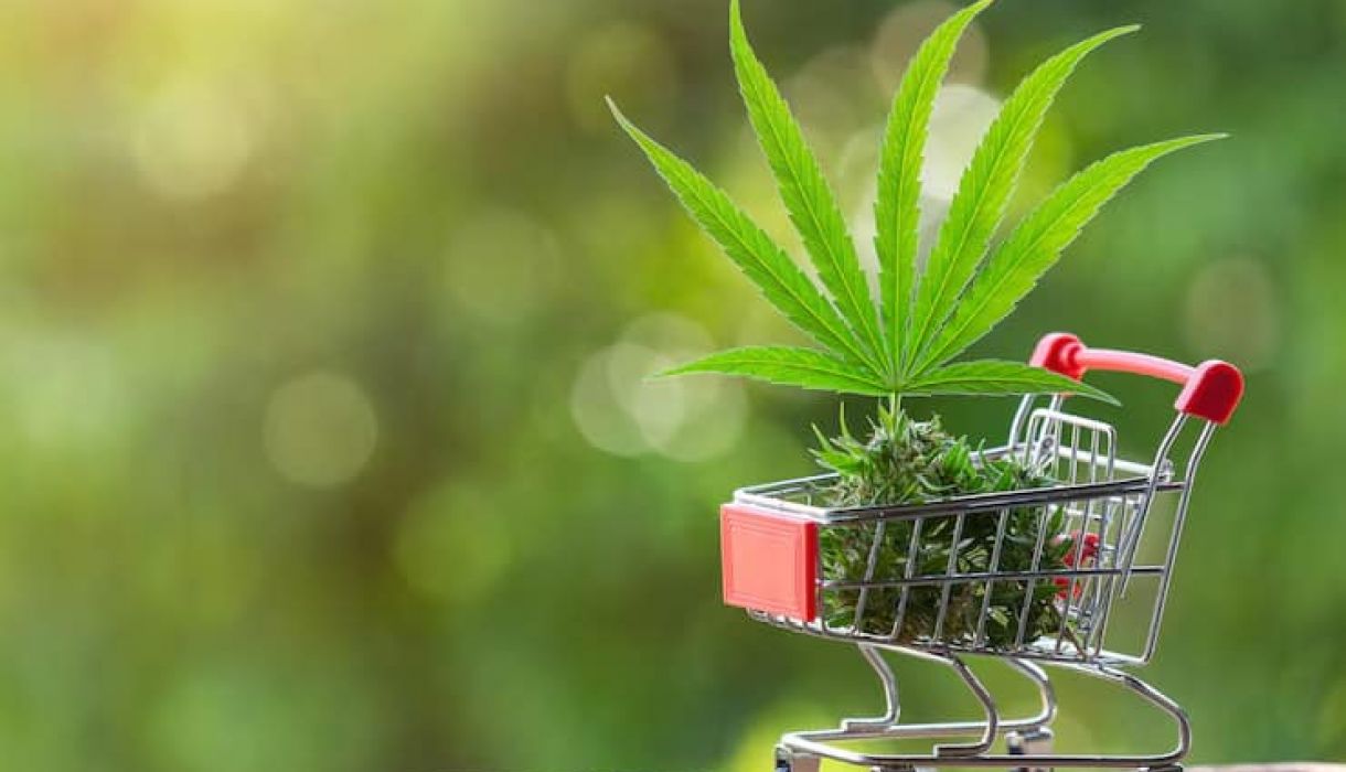 Cannabis leaves and products in a shopping cart representing dispensary product selection in Pahrump Nevada
